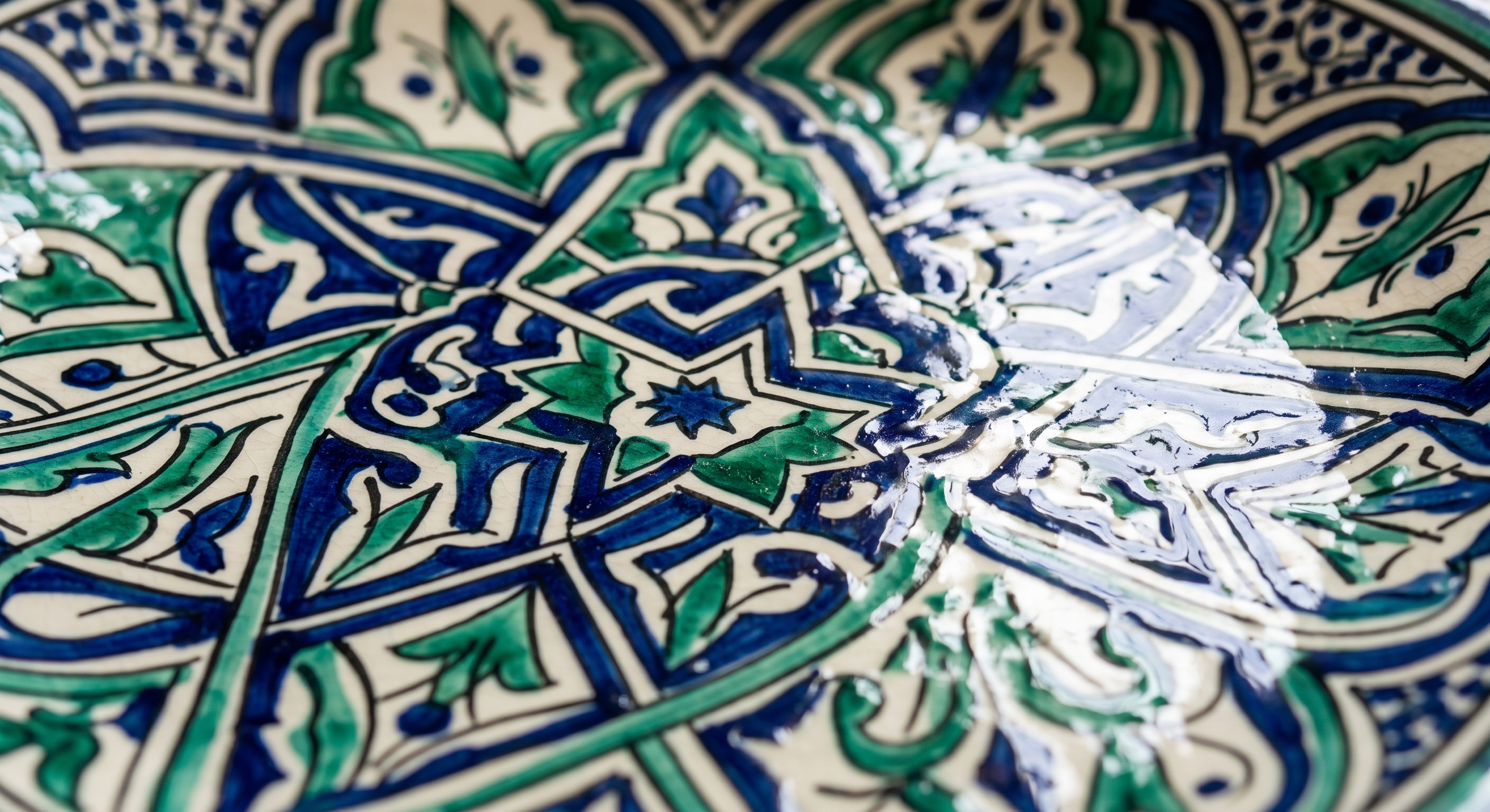 Close-up of Safi ceramic in cobalt blue and emerald green