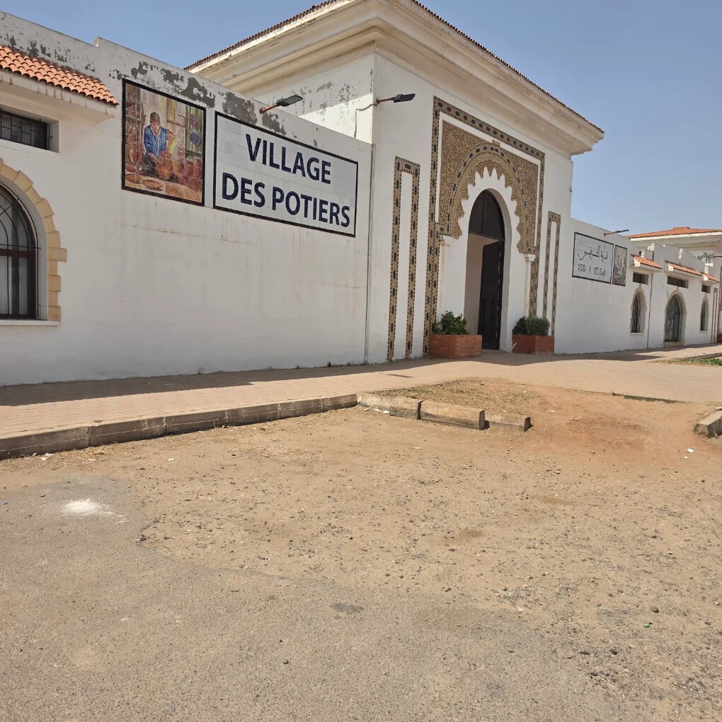 Village des Potiers in Safi — pottery shops lining a sunlit street
